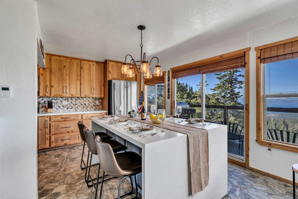 Dining area: Kitchen island with 6 barstools, open to living room