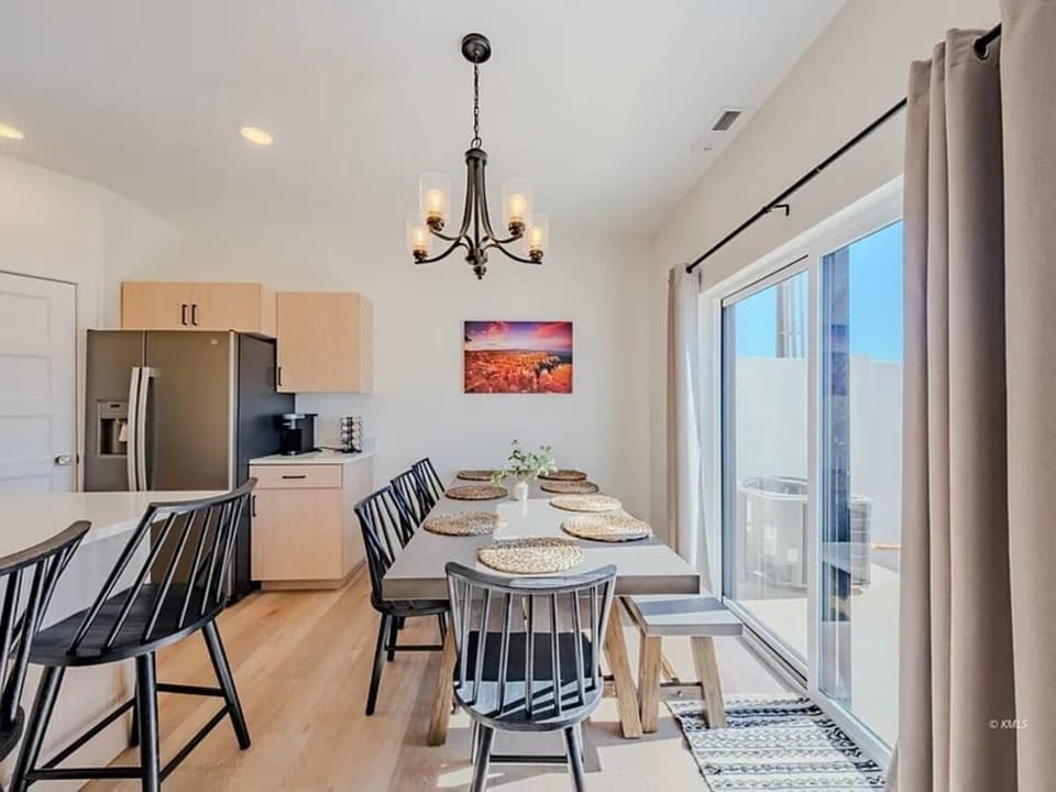 The dining table has seating for 8 with additional seating at the bar