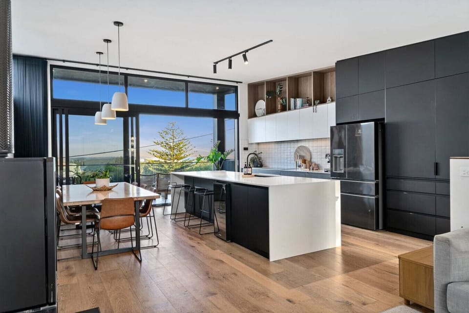 Open-plan living with panoramic coastal outlook