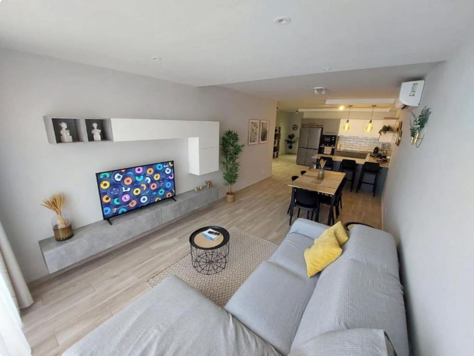 Apartment, 3 Bedrooms, Air conditioning, Beachside | Living area | Flat-screen TV