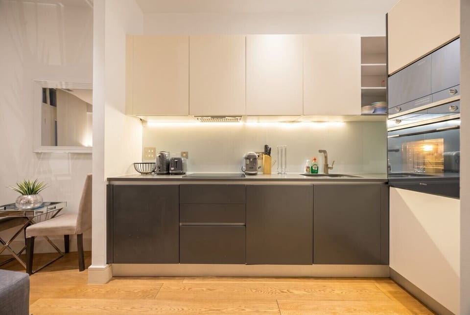Sleek galley kitchen equipped for easy home-cooked meals.