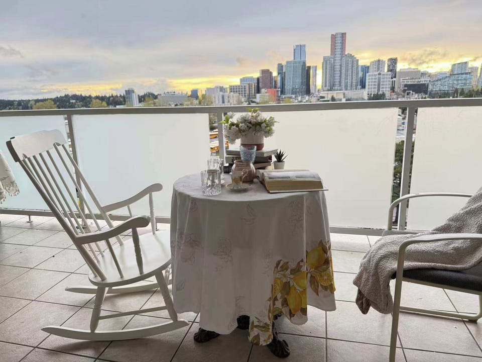 Unwind with a glass of wine on the balcony as you watch the sun set over the stunning city skyline—your ultimate evening escape.