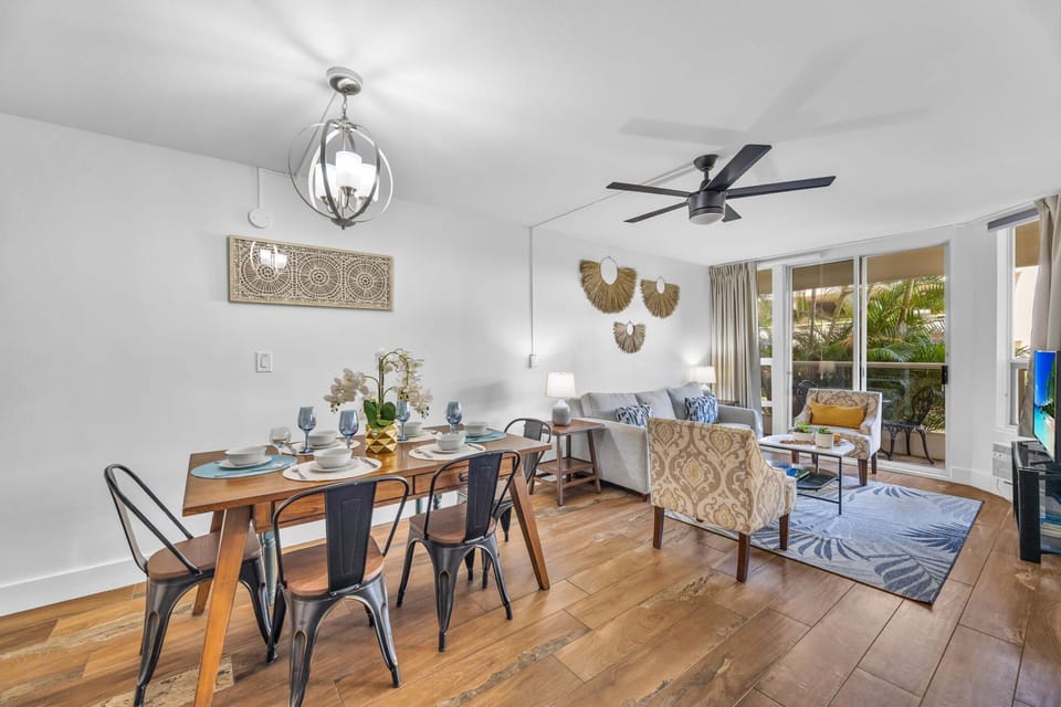 Open-concept living and dining area with balcony access