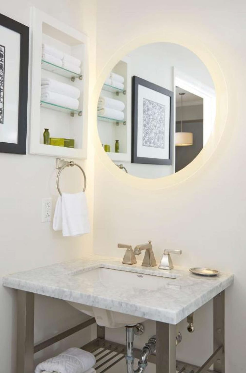 Bathroom with vanity and fresh towels.