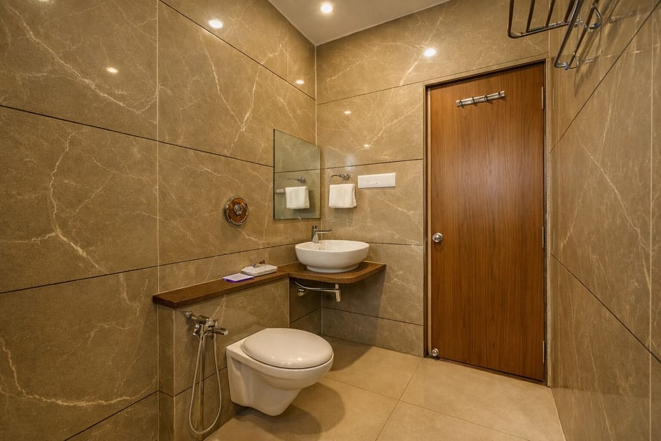 Deluxe Room With Pool View | Bathroom | Designer toiletries, towels, soap, shampoo