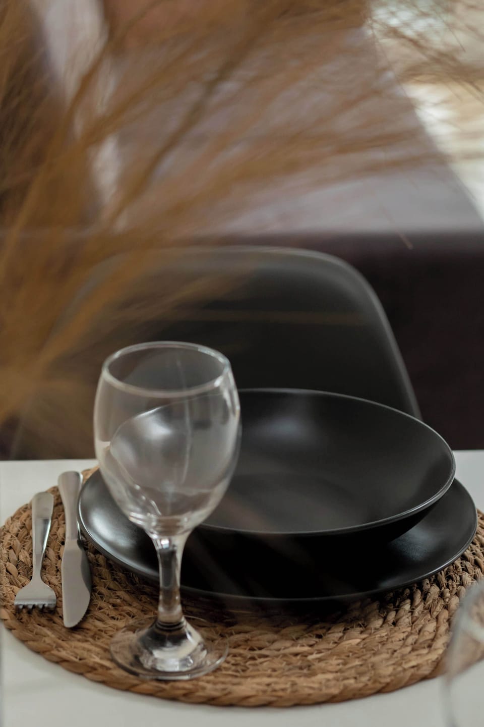 Beautifully arranged dining setup with glassware and decor, creating an inviting atmosphere for meals.