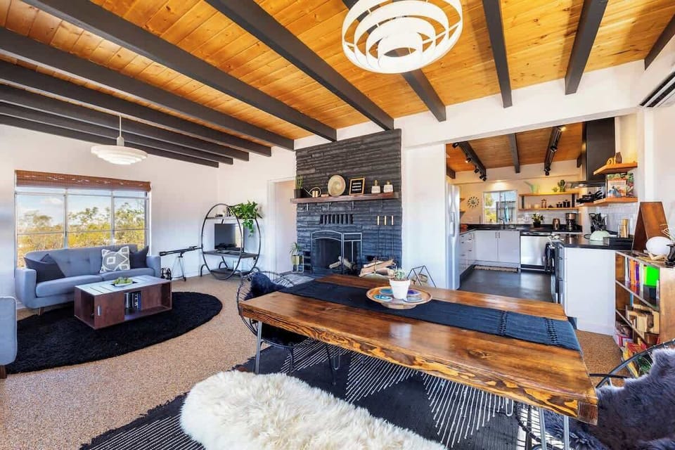 Cozy living room, great for group dining, game night, socializing, or snuggling by the fire  