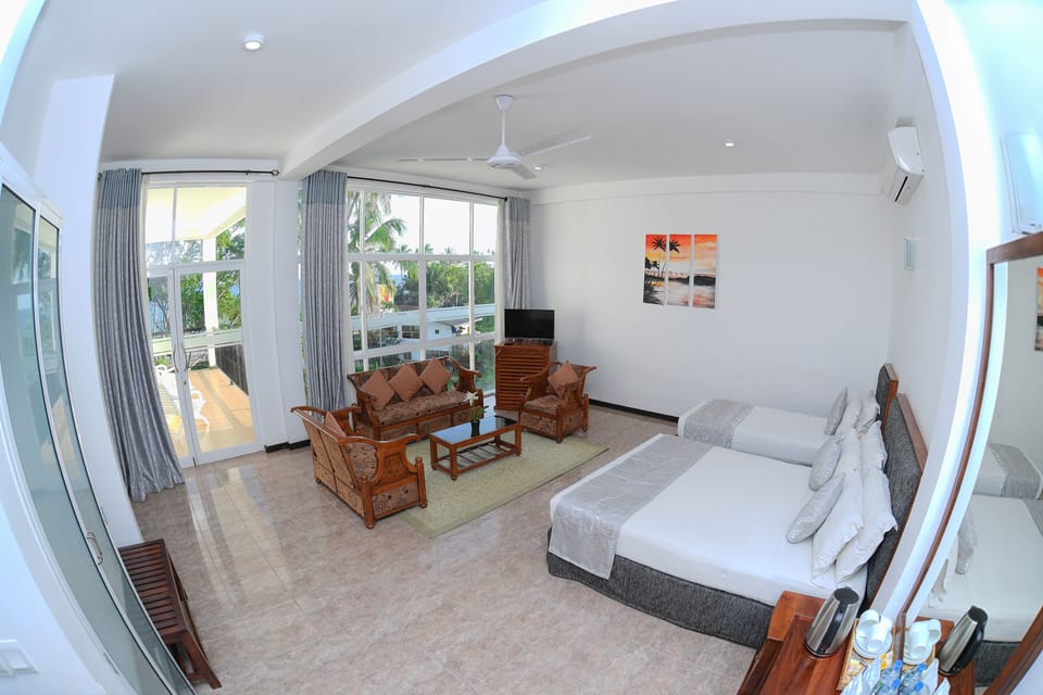 Family Room | Minibar, in-room safe, desk, blackout drapes
