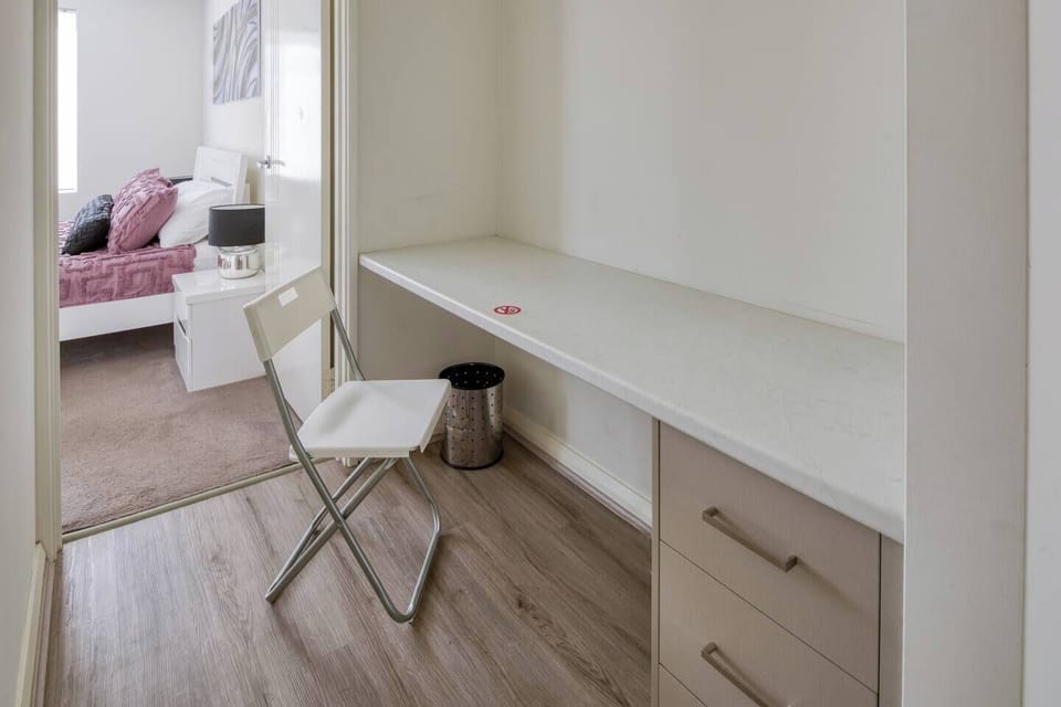 A dedicated workspace in the primary room makes it easy to set up your laptop and work remotely.