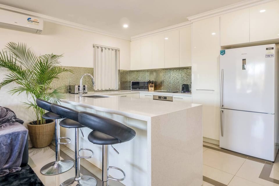 The kitchen bar provides the perfect spot to enjoy culinary delights, engage in lively conversations, and create lasting memories.