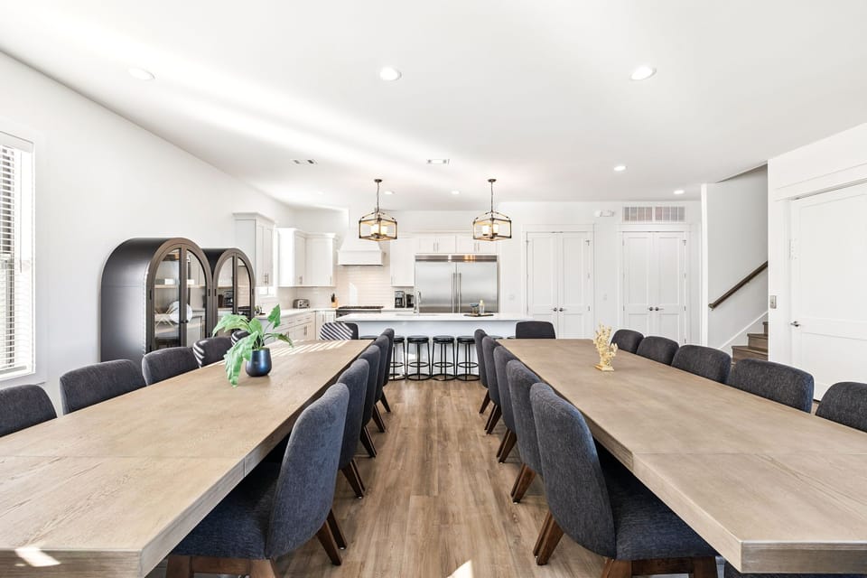 Gather around these stunning dining table where your group can share memorable meals together, with the gourmet kitchen just steps away for easy entertaining.