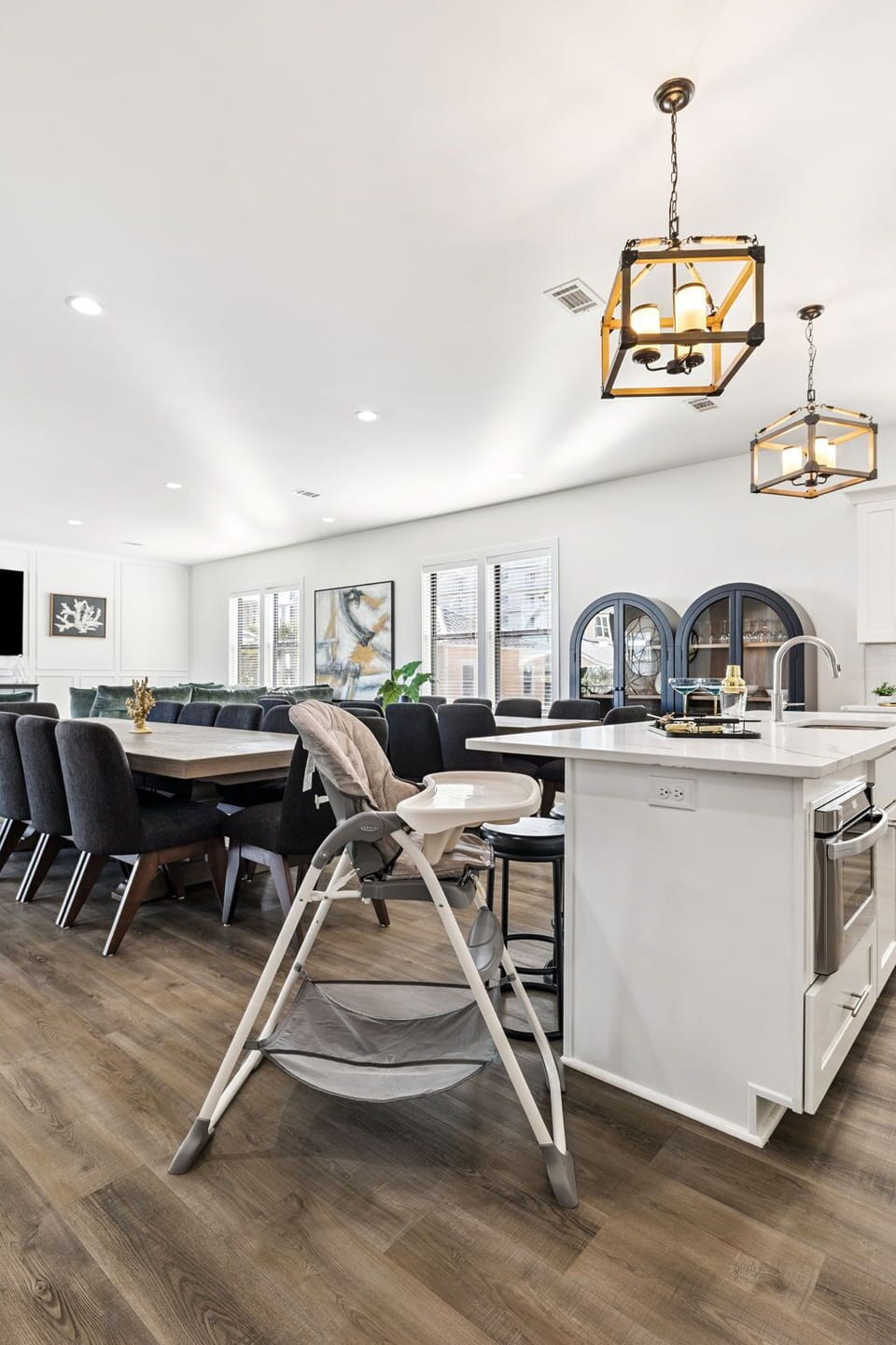 Cook meals in the spacious kitchen while little ones sit safely nearby, then gather at the dining table for memorable family moments together.