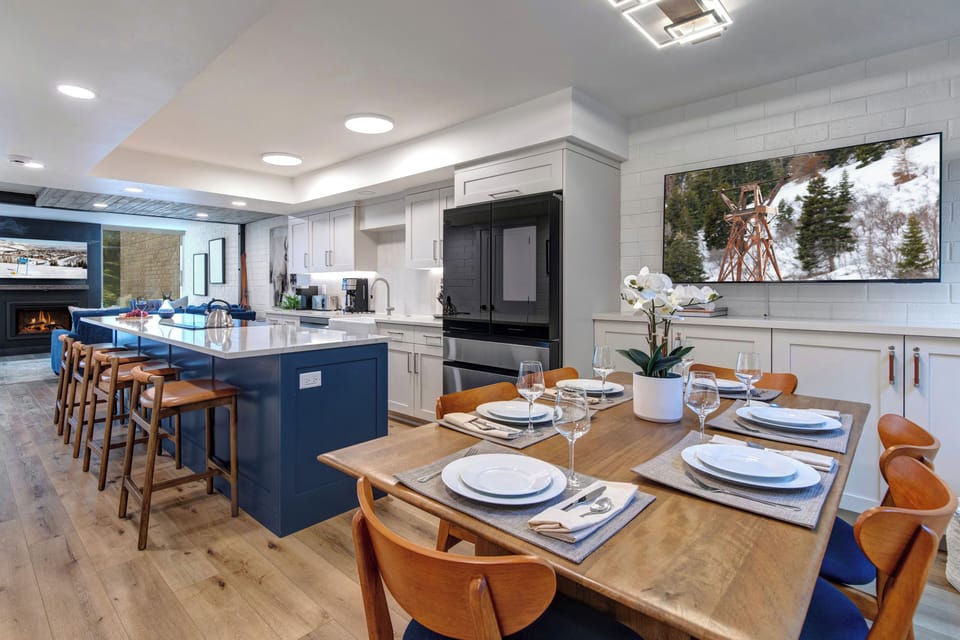 The open concept dining room with a flat screen TV.