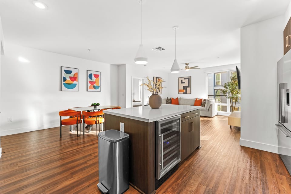 Impressive center island with ample seating & a built-in wine cooler center