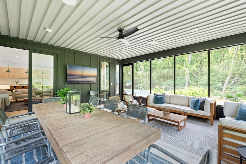 Bright sunroom surrounded by windows — a serene space to unwind year-round