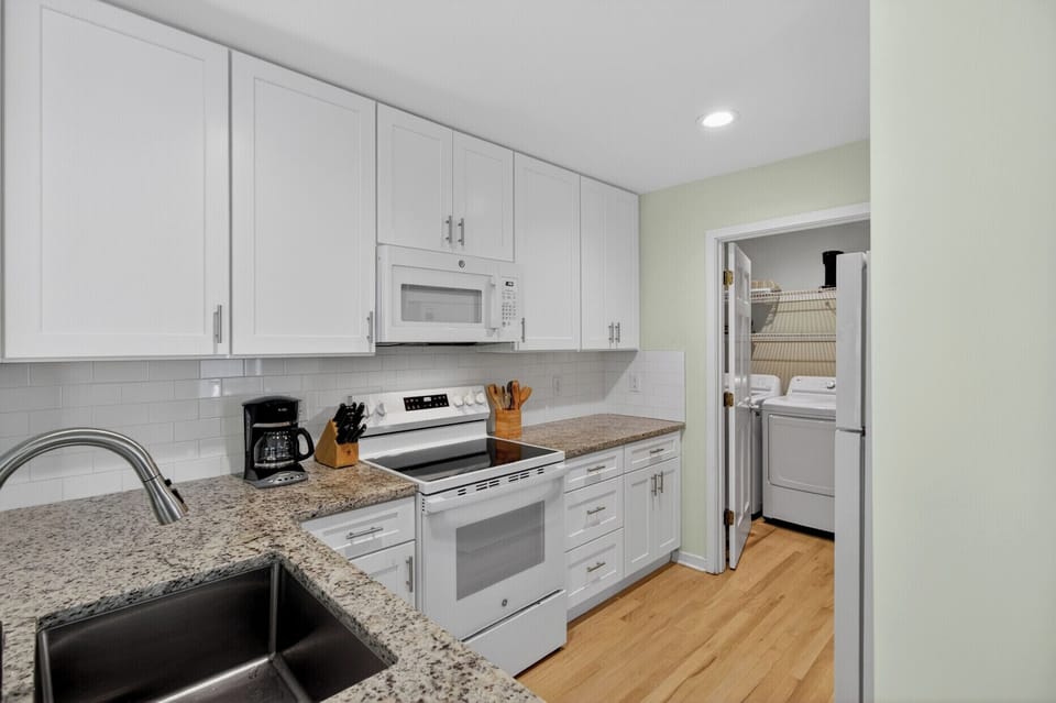 Your fully equipped kitchen features granite counters, modern appliances, and everything you need to prepare memorable meals during your stay.