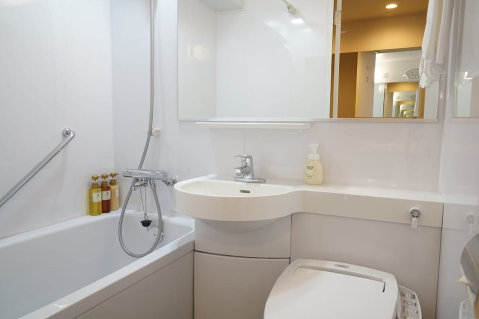 Shower, free toiletries, hair dryer, slippers