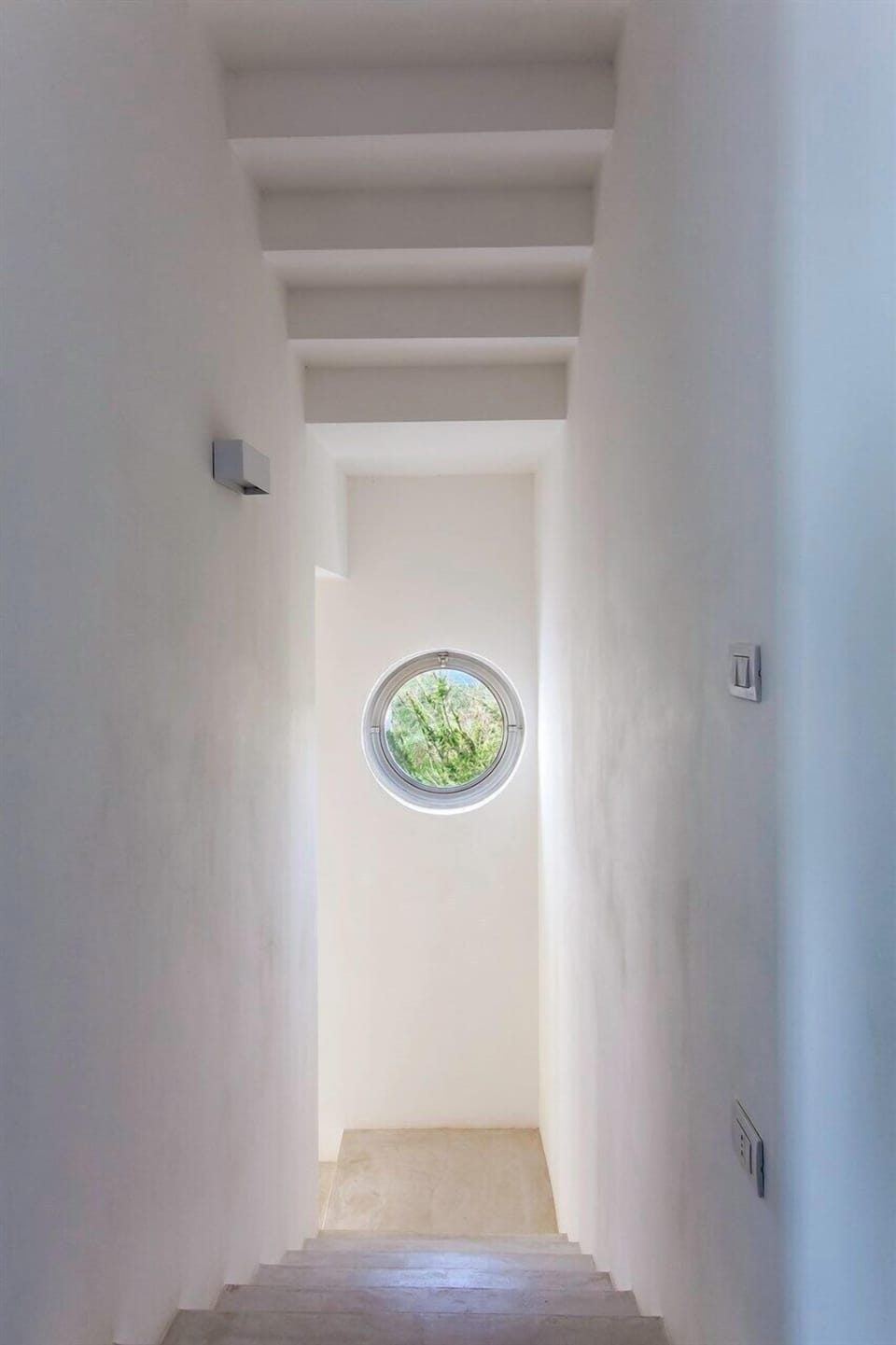 The stairs leading to the first floor.