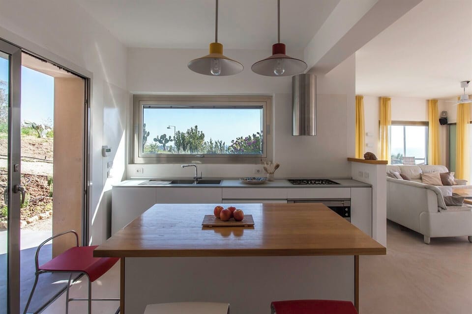 The bright, hi-spec kitchen with its sea views and breakfast bar.
