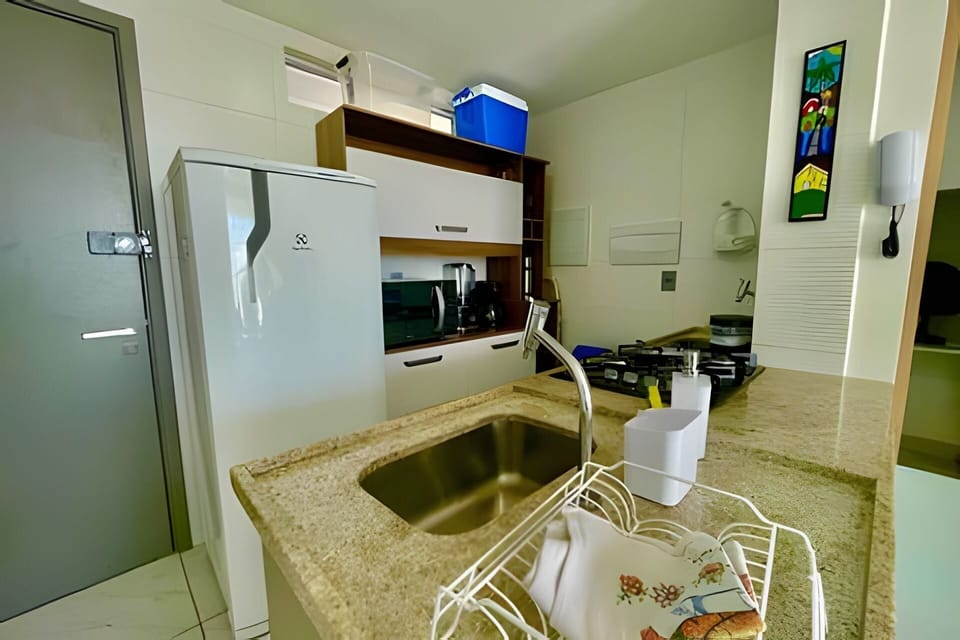 Standard Apartment | Private kitchen | Microwave, stovetop, cookware/dishes/utensils