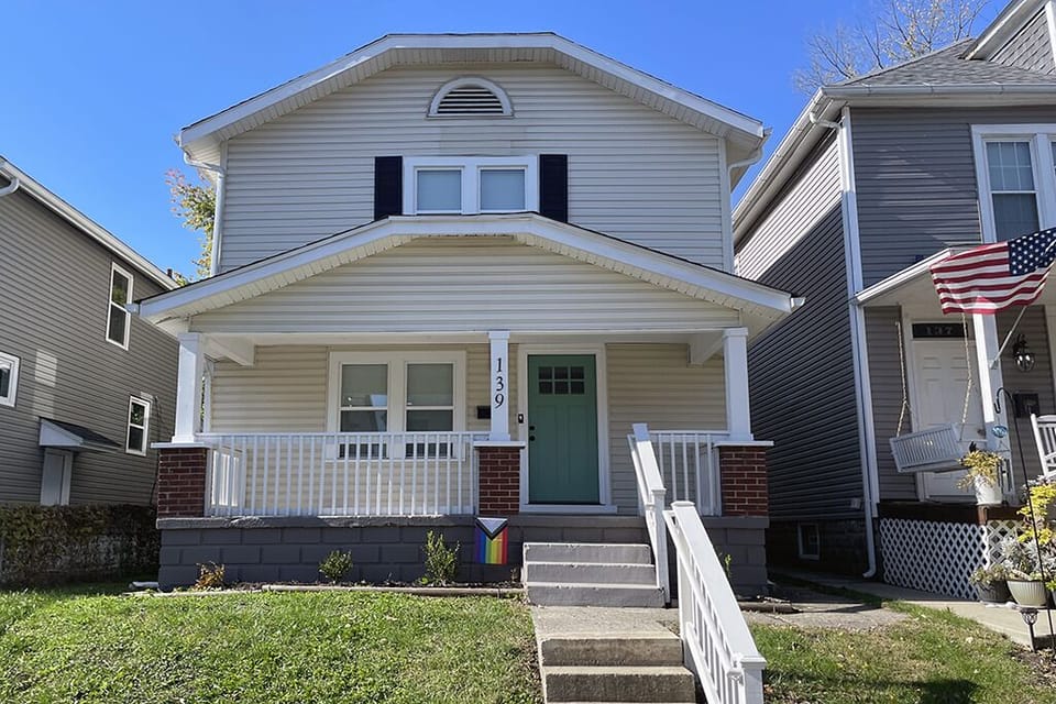 Charming private home with porch, free parking, and fenced yard.