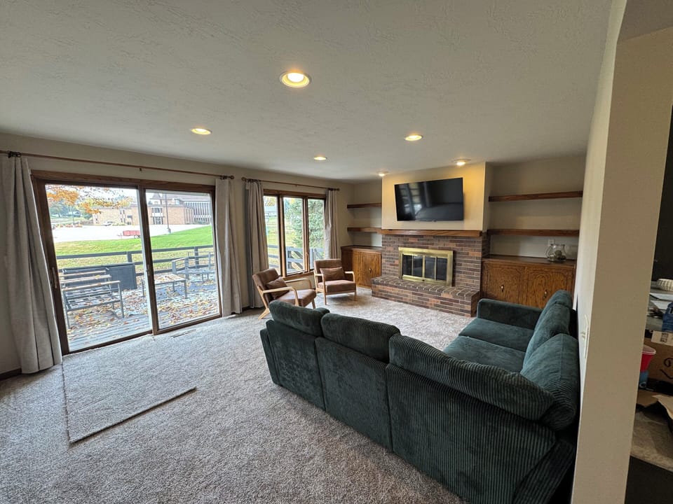 Living area with additional sofa bed along with 55 inch smart tv.  