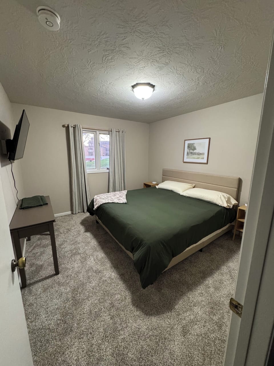 Bedroom 1 with king size bed and 43 inch smart tv. Also plenty of closet space. 