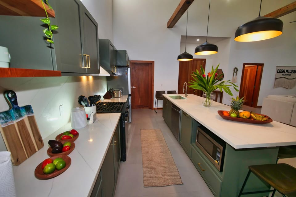 Modern kitchen with sleek countertops and vibrant accents