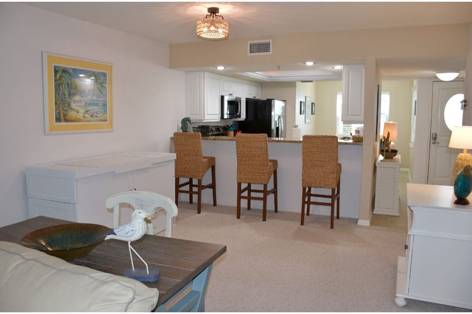 Where happy hour meets chill hour—bar, Murphy bed, and plenty of room to relax.
