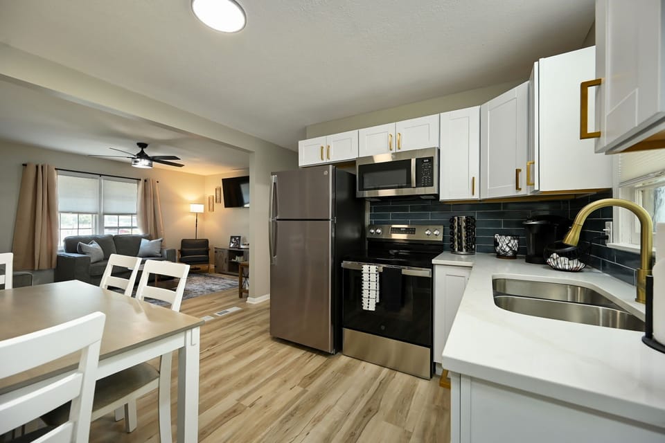 Clean, modern kitchen setup designed for convenience during extended Kansas City stays or major events like the World Cup.