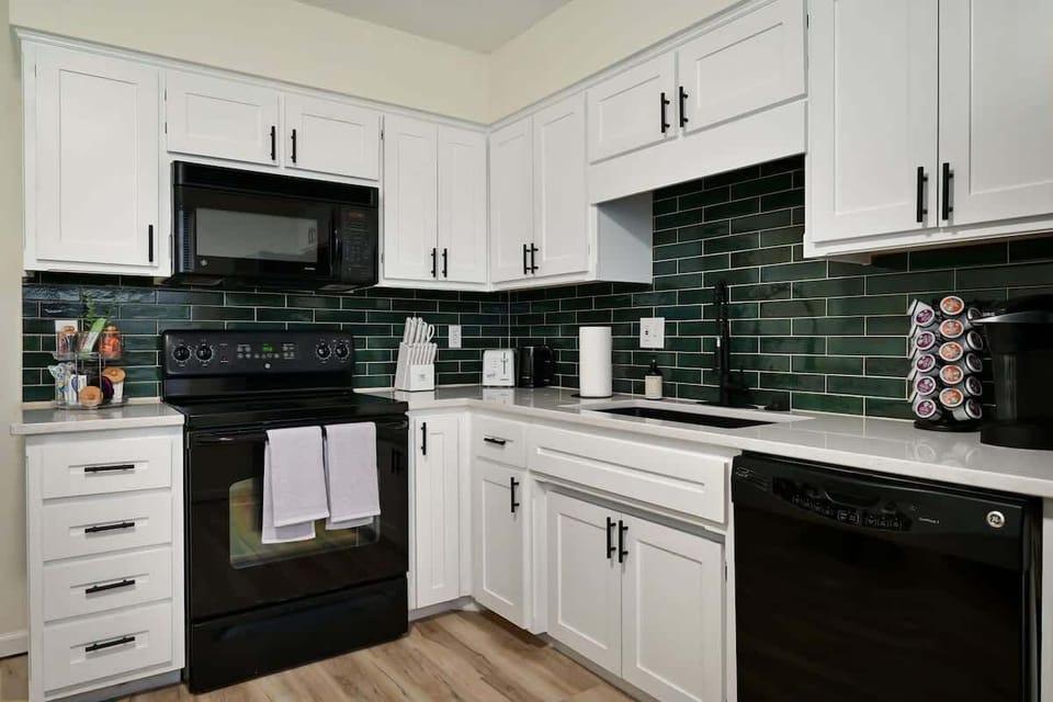 Fully equipped kitchen with updated appliances, quartz counters, and everything needed for cooking during your stay