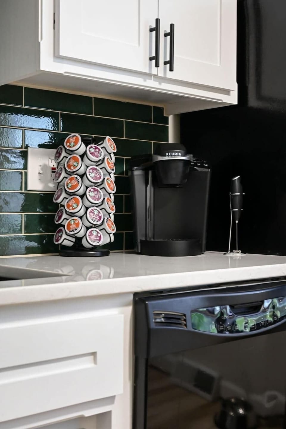 Coffee station with Keurig, K-cups, and frother ready for your morning routine.