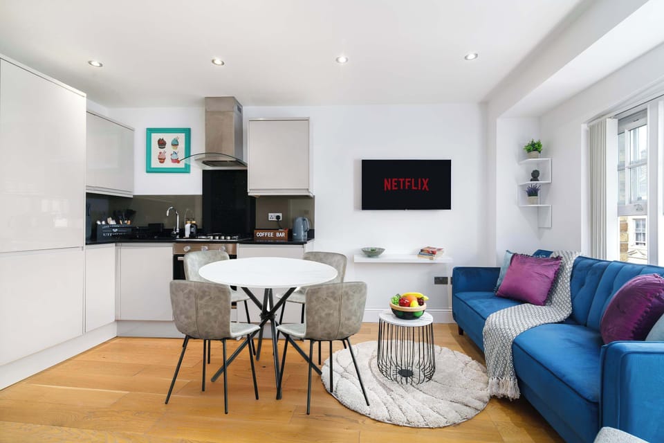 Open-plan dining and kitchen area with everything you need for family meals or long stays in East London