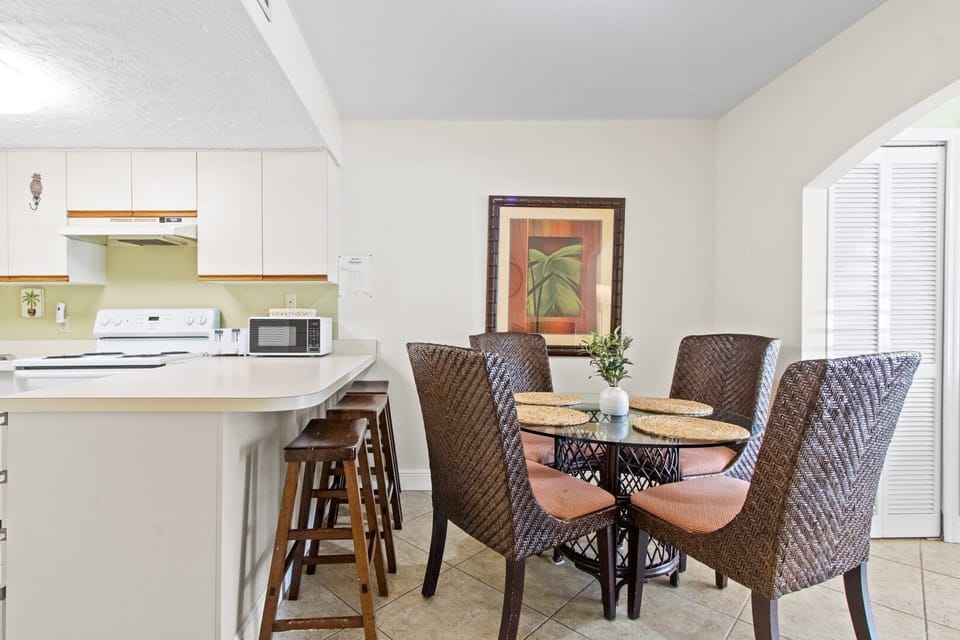 Breakfast bar seats three and dining table seats four