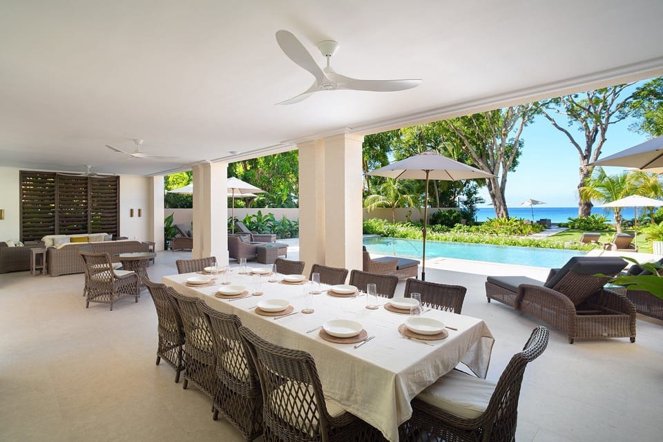 The expansive terrace offers shaded lounges and al fresco dining