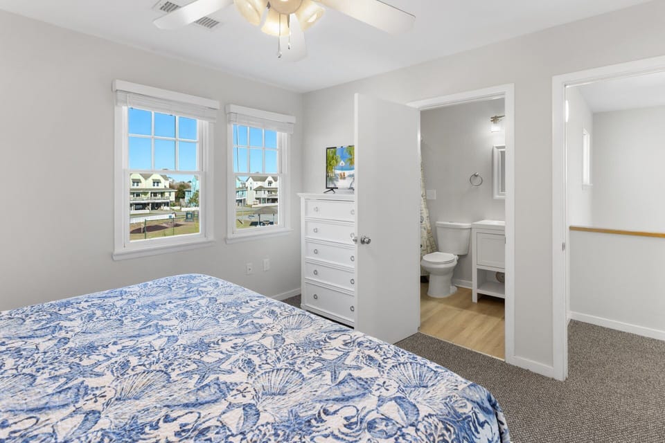 Top Level: King master bedroom with private bathroom and relaxing décor.