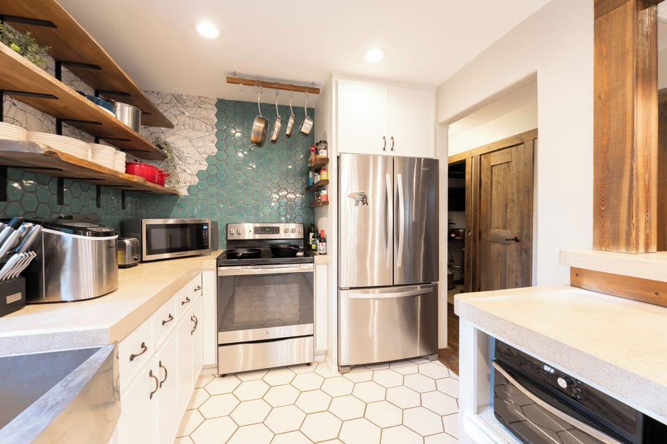 Stainless steel appliances throughout the kitchen for your convenience. | Main Level