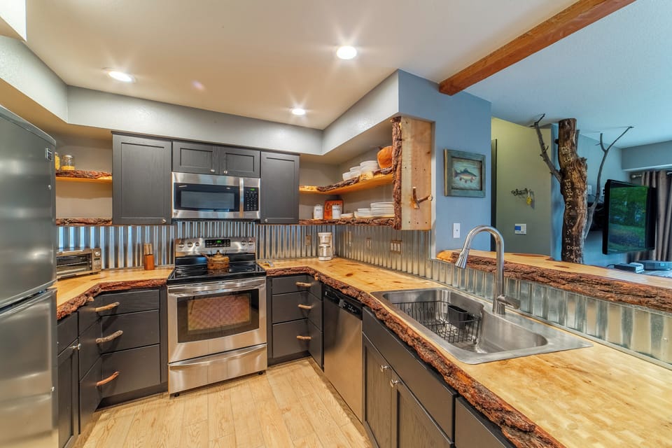 Updated kitchen w/ stainless steel appliances.