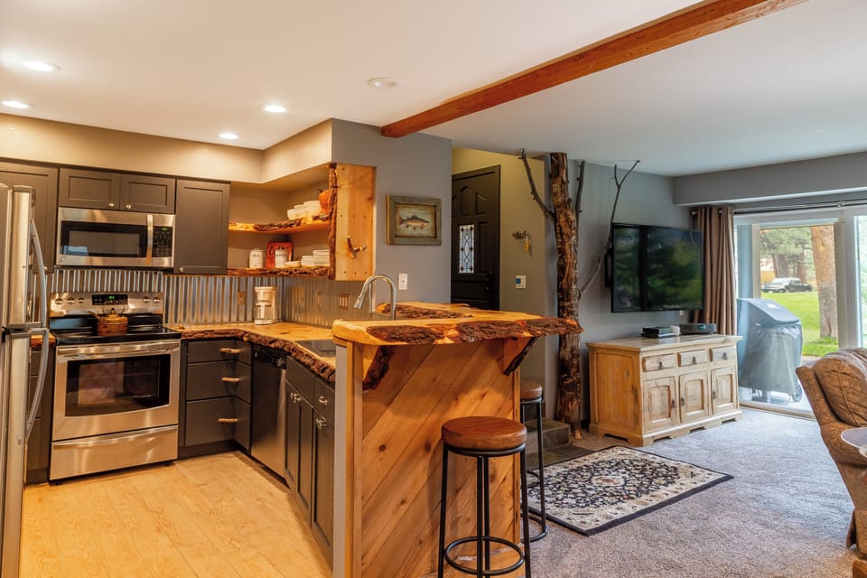 Kitchen area open to living room and patio.