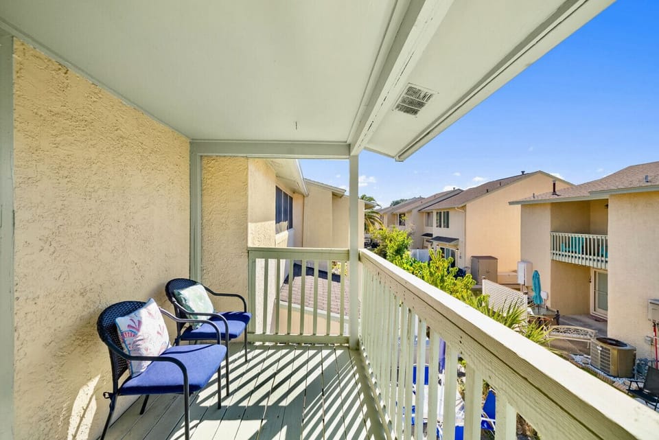 Balcony Seating: Peaceful covered balcony with cozy chairs to enjoy your morning coffee or evening breeze
