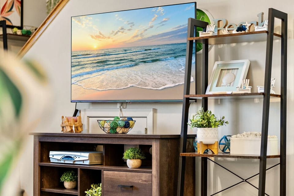 Smart TV and beachy accents create the perfect spot for a cozy movie night