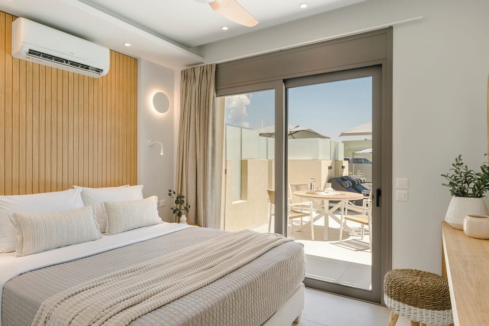 Junior Suite, Balcony, Pool View | In-room safe, iron/ironing board, free WiFi