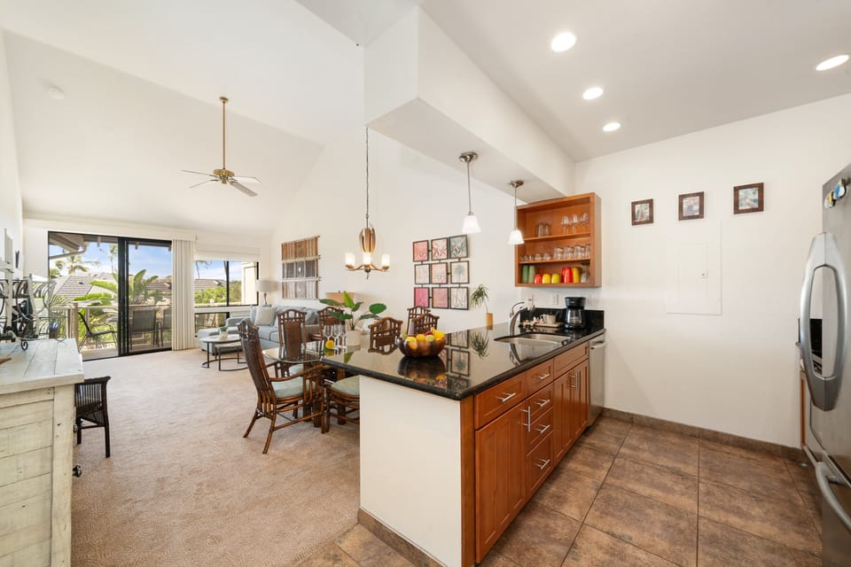 Enjoy an open-concept kitchen and dining area with sleek granite counters and easy access to the living space