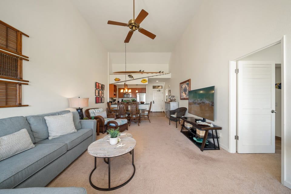 Enjoy a spacious living area featuring high ceilings, stylish décor, and a cozy setup perfect for unwinding after a day of adventure
