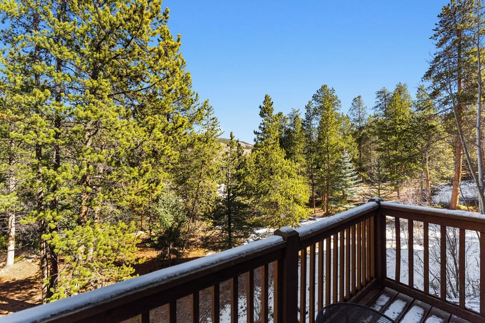 Step onto your private balcony and breathe in the crisp mountain air while gazing at snow-dusted pines and towering evergreens.