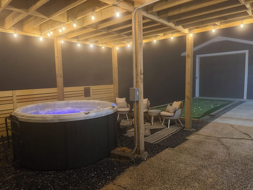 Covered hot tub area for a cozy experience in any season.