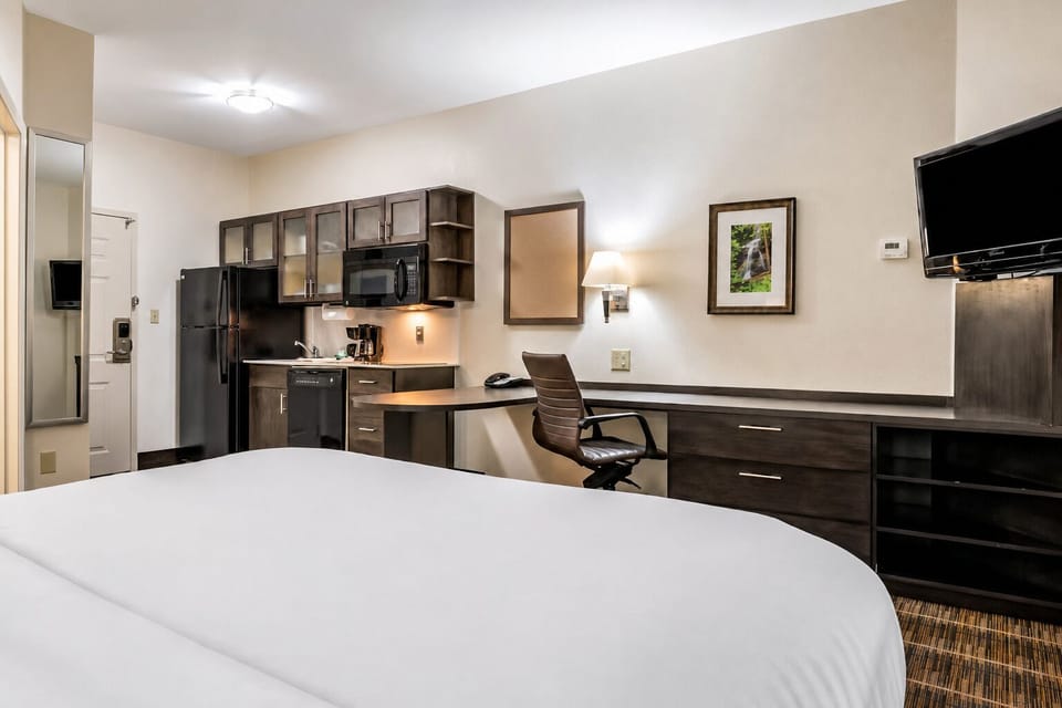 Unwind in a spacious studio with kitchenette and plush bed.