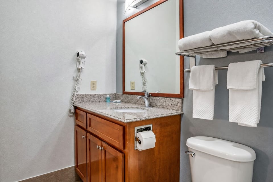 Refresh easily with bright vanity space and stocked towels.