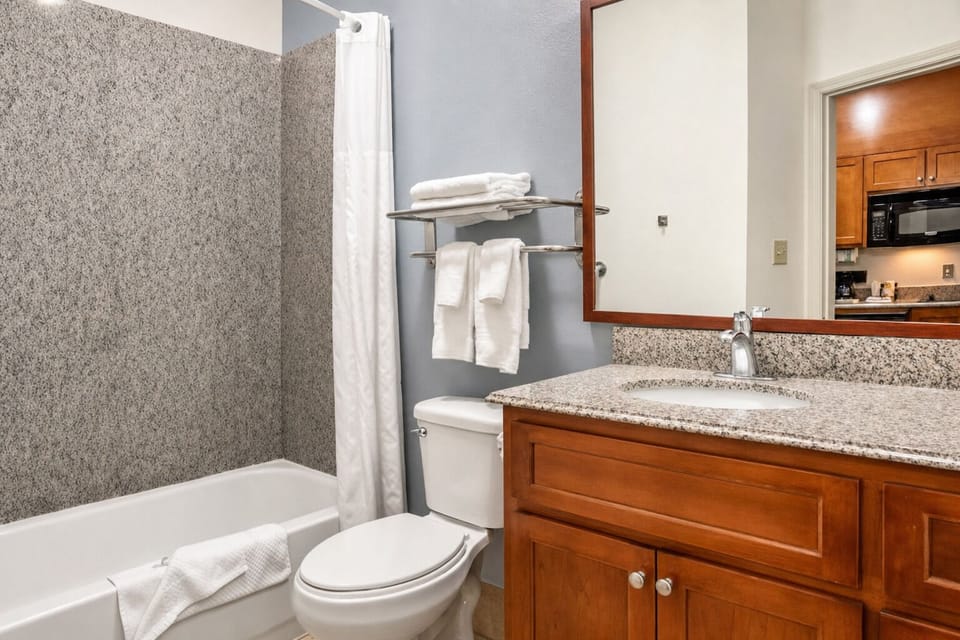 Refresh easily with a bright vanity and fluffy towels.