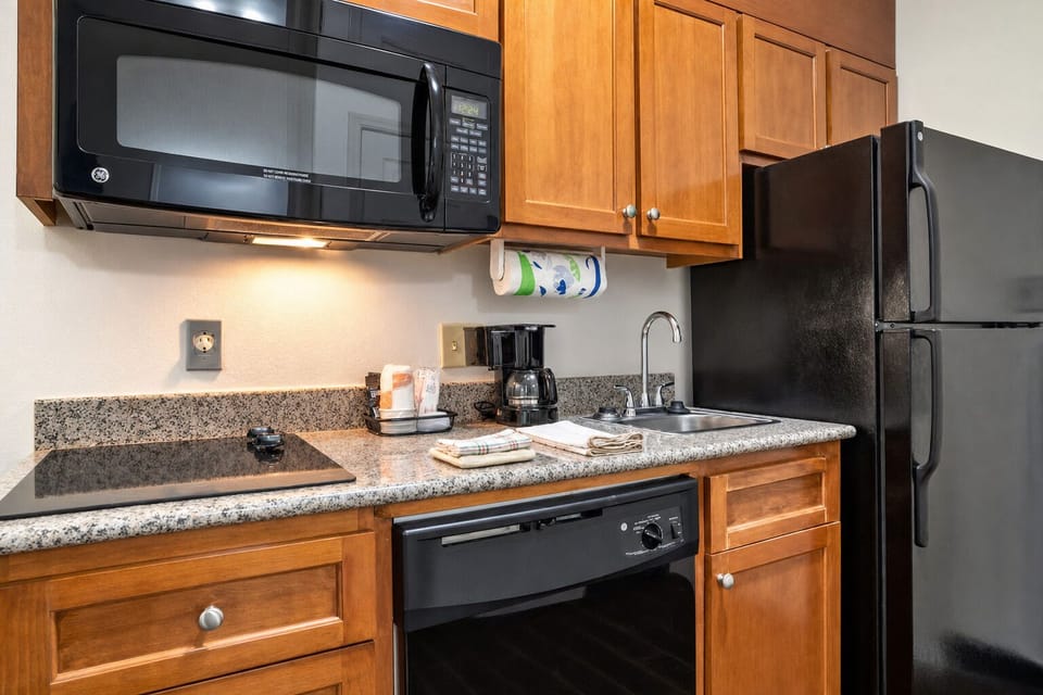 Cook with ease using a full fridge and sleek cooktop.
